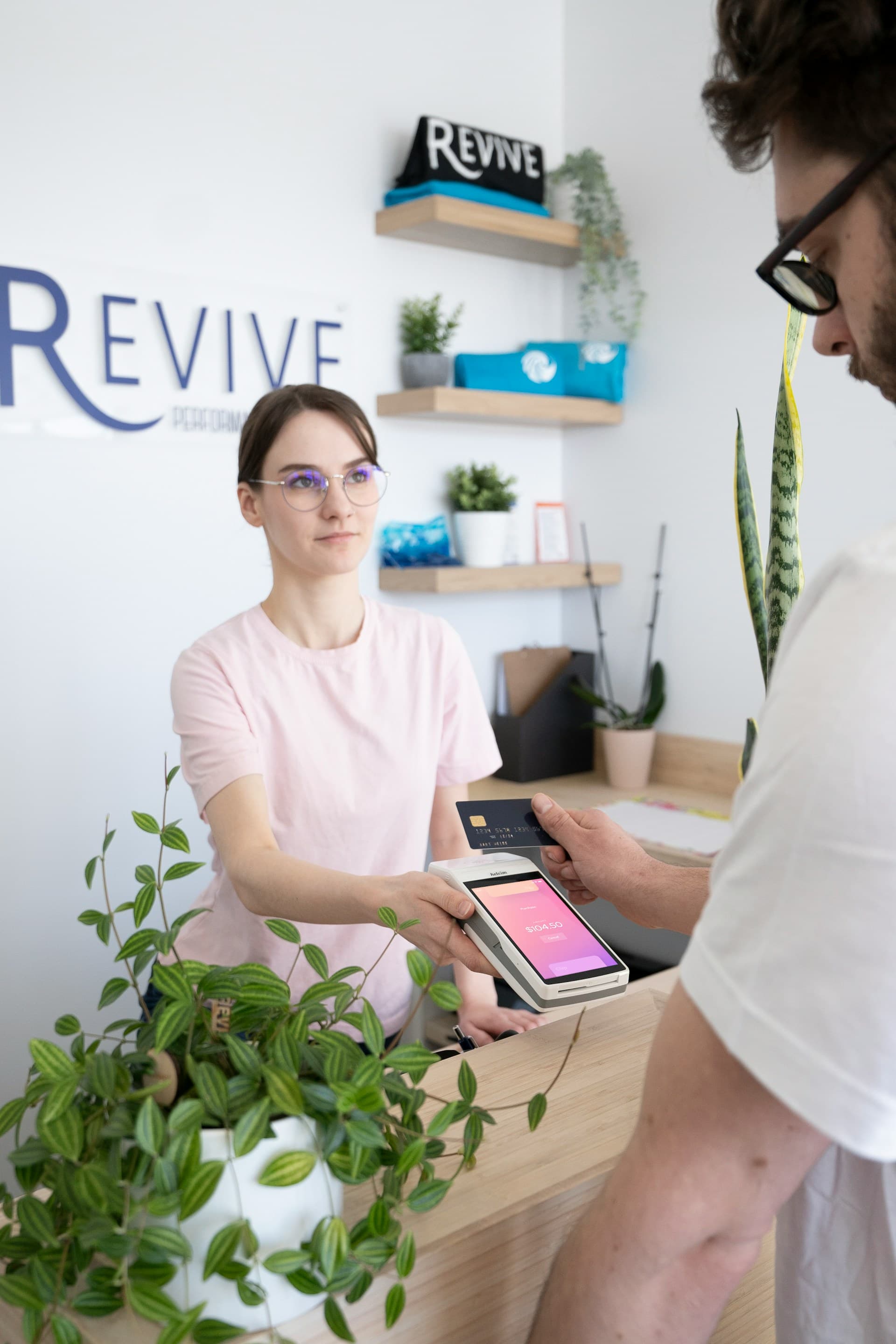 Chiropractor speaking with a patient before an adjustment