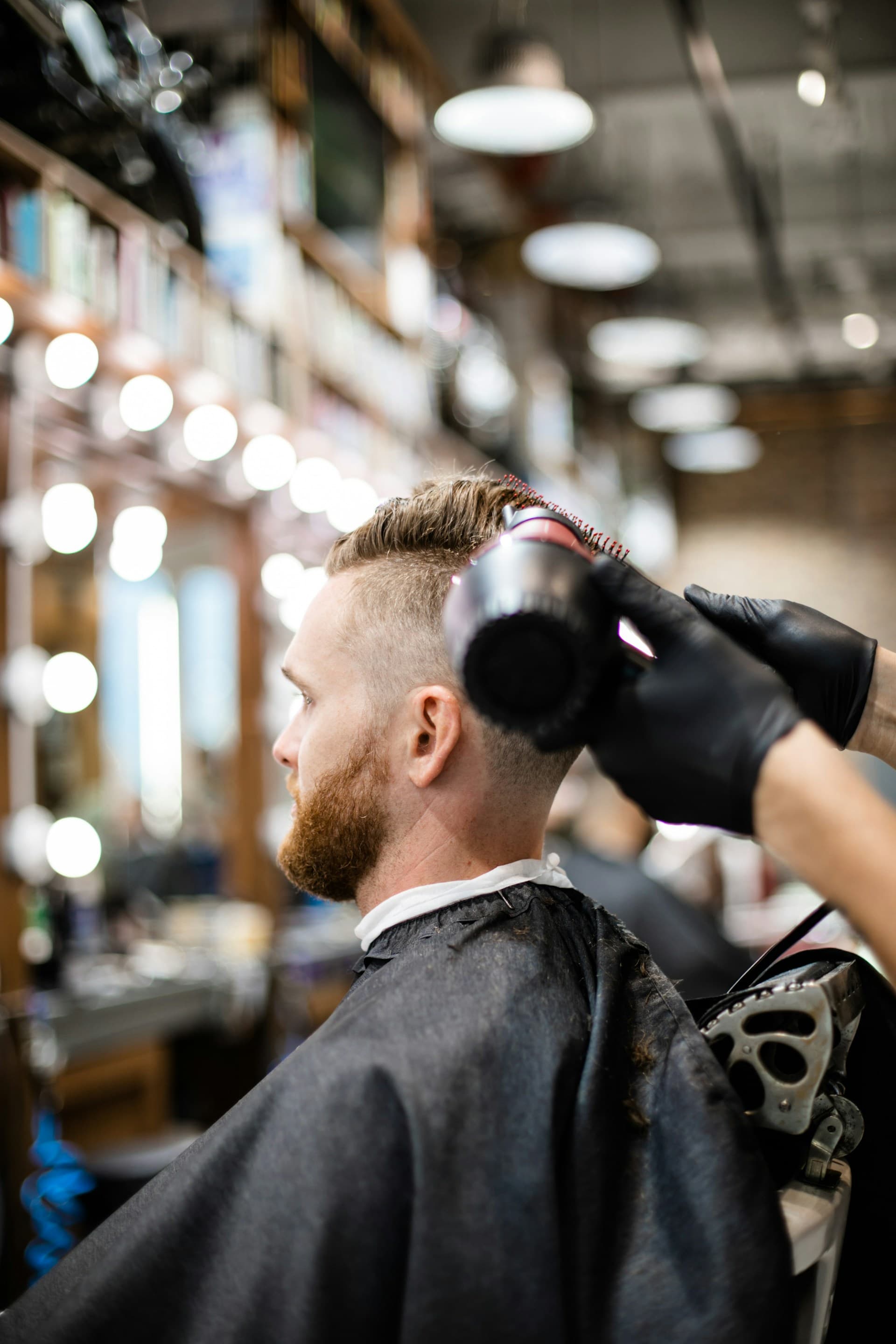 Barbershop interior with barbers at work