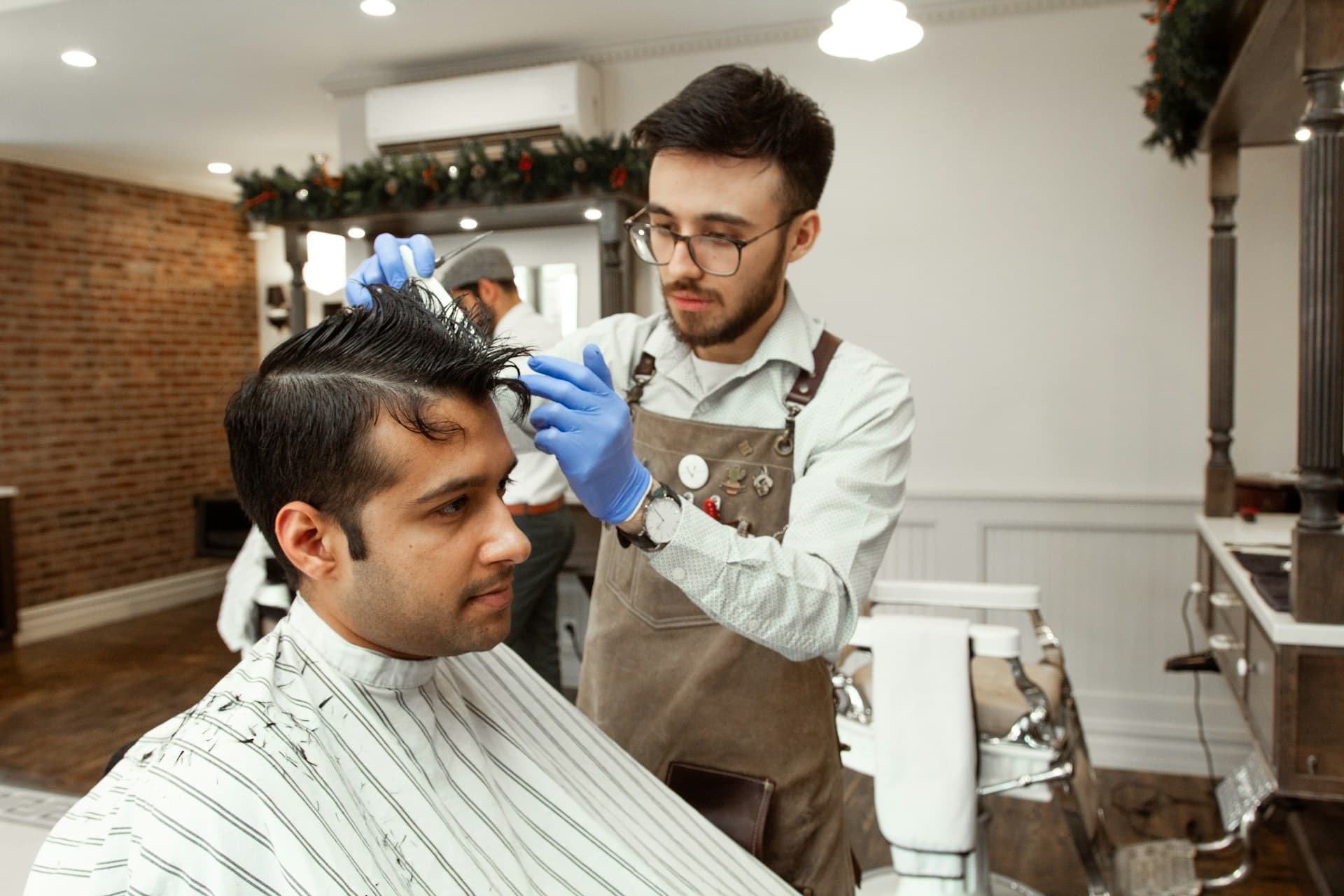Client getting a haircut in a barbershop