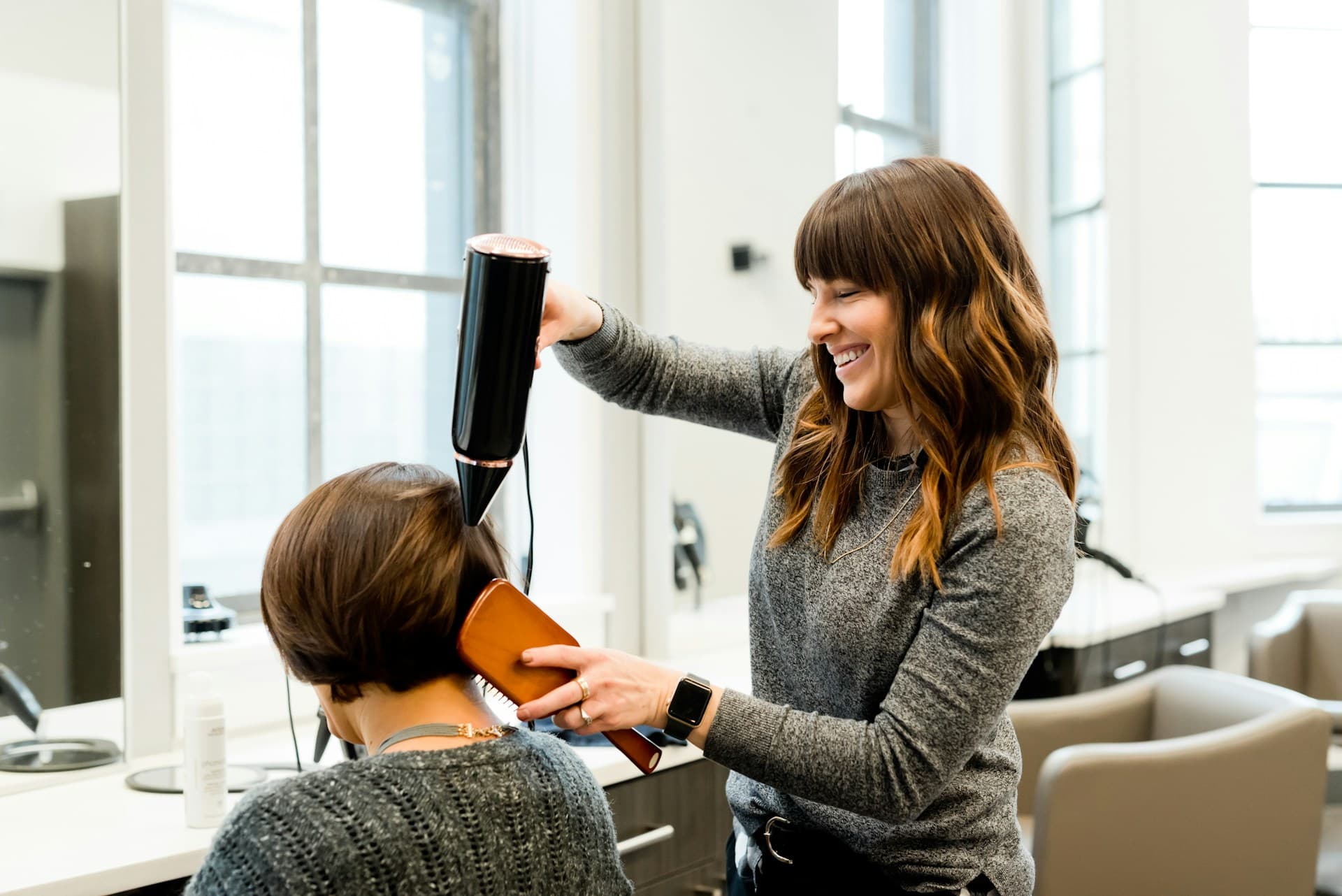 Client getting hair styled in a salon