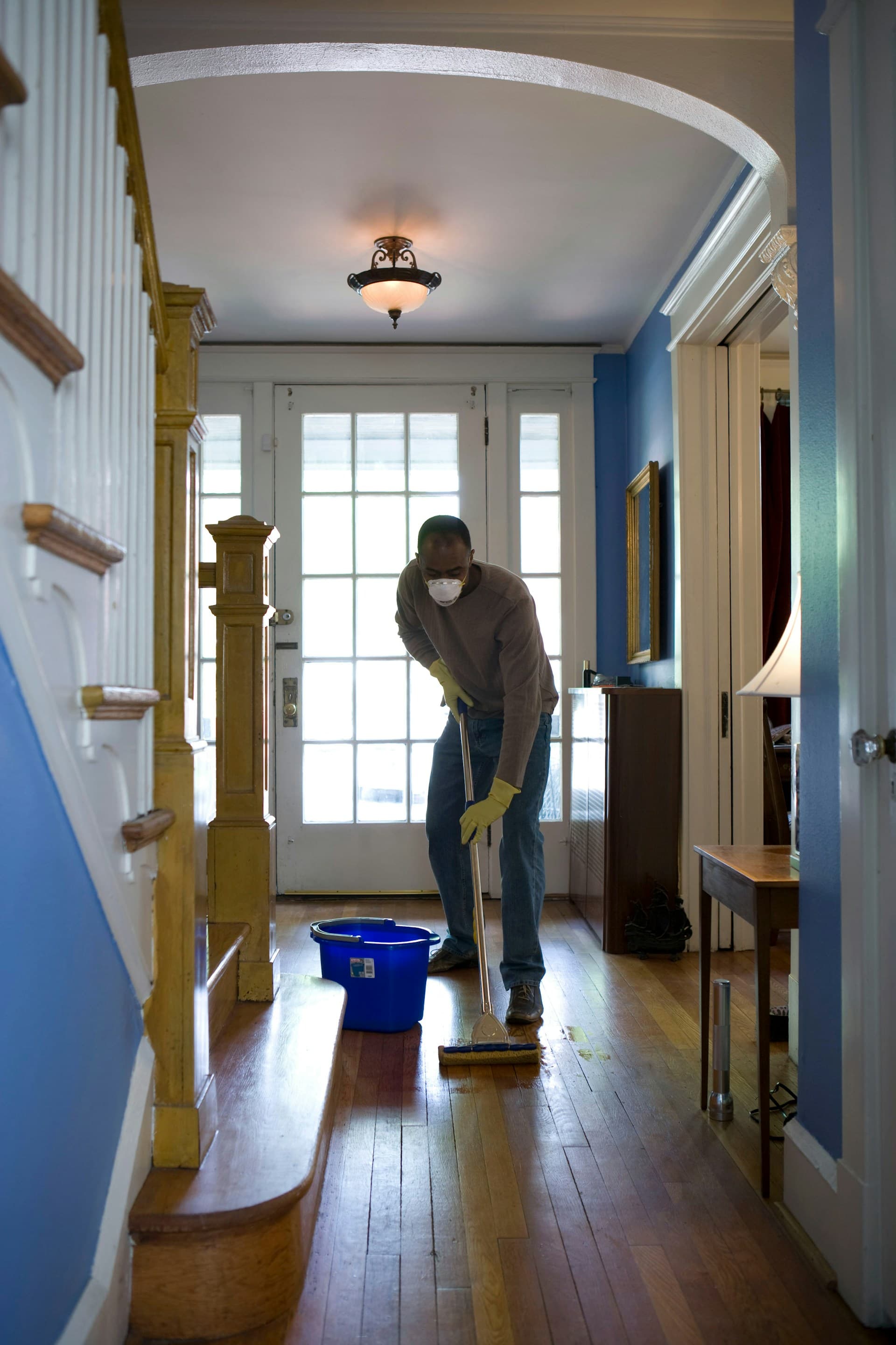 Cleaner wiping down a kitchen counter